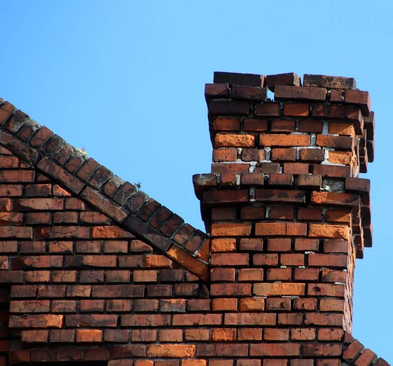 Signs Your Lemon Grove Home Needs a Chimney Inspection Damaged chimney on an Lemon Grove home showing cracks and missing mortar